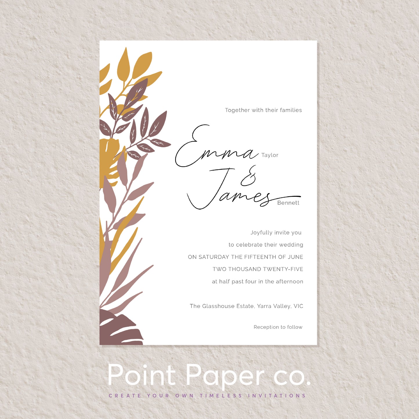 A wedding invitation card with a white background, black script text, and a botanical leaf illustration in mustard yellow and taupe on the left side, displayed on a light textured wall. The card is branded with 'Point Paper co.