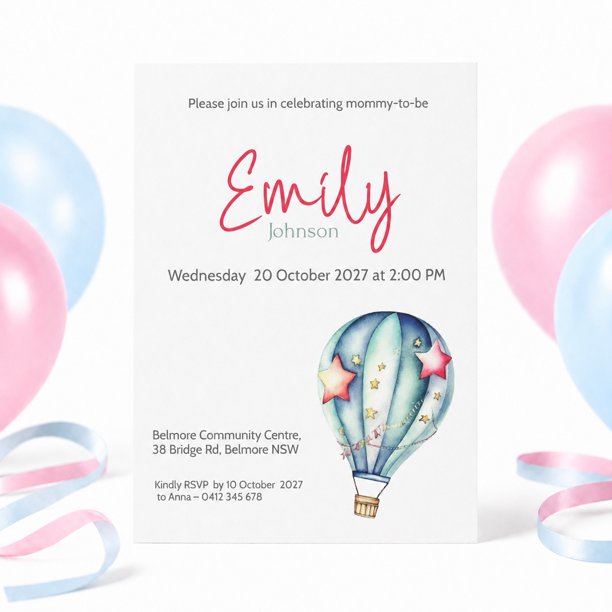 A baby shower invitation card for Emily Johnson, featuring a colorful watercolor hot air balloon design. The card is displayed against a white background with pink and blue balloons and ribbons in the background.