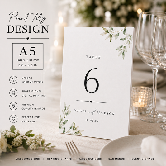 A5 wedding table number sign displayed on a table setting, with botanical watercolor accents and customizable text. The image includes a design customization panel on the left with text reading 'Print My DESIGN' and size details for an A5 card.