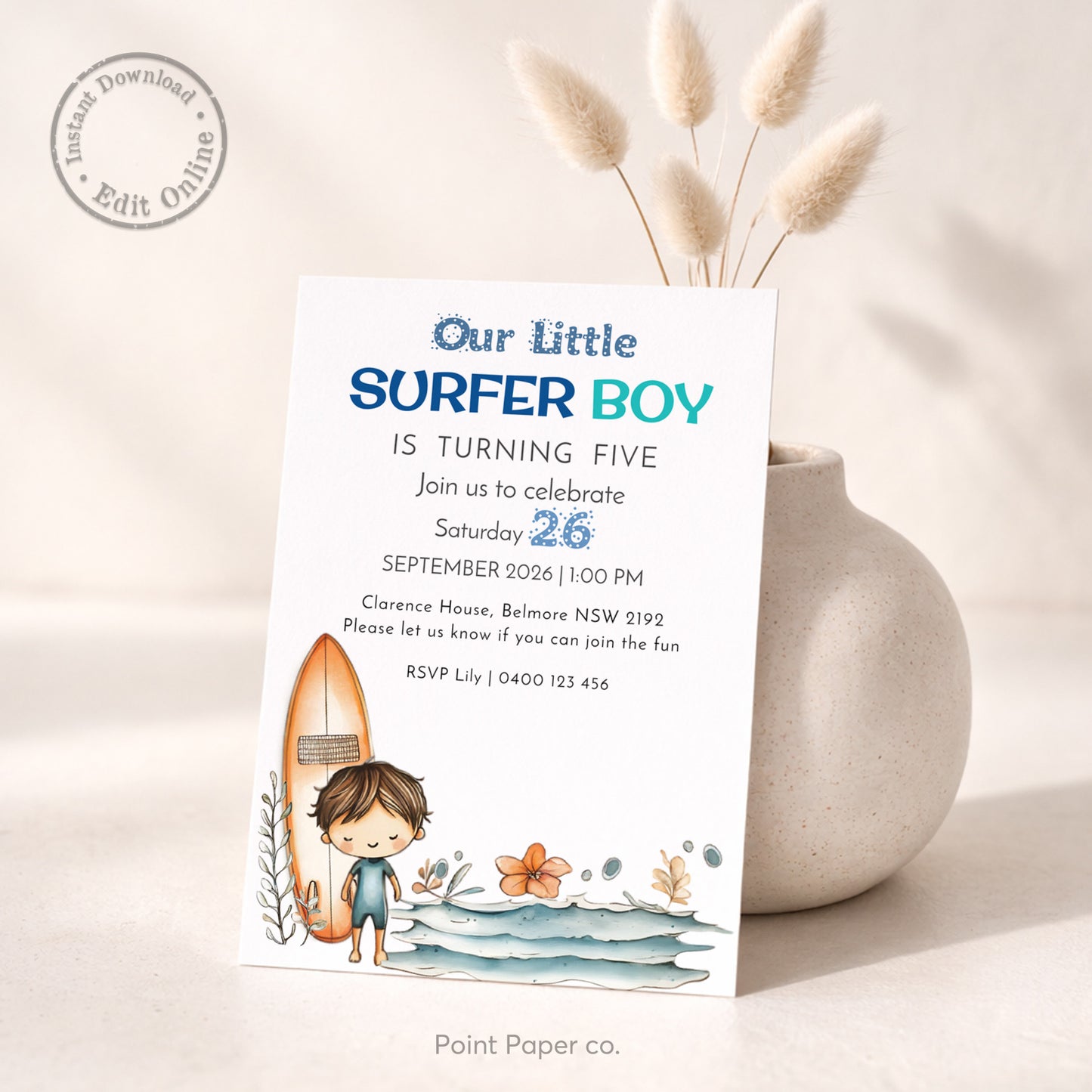 Invitation card for a 'Little Surfer Boy' birthday party with a surfboard and beach elements, displayed on a neutral background.